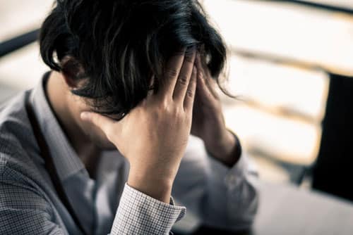 a business man is stressed from his work, depressed and anxious