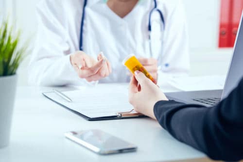 photo of a female client consulting her doctor about a medication
