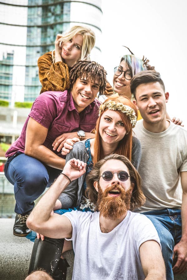 photo of happy friends hanging out outdoor