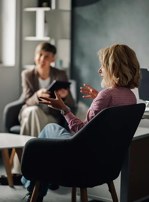 Patient explaining problems to psychologist during therapy session